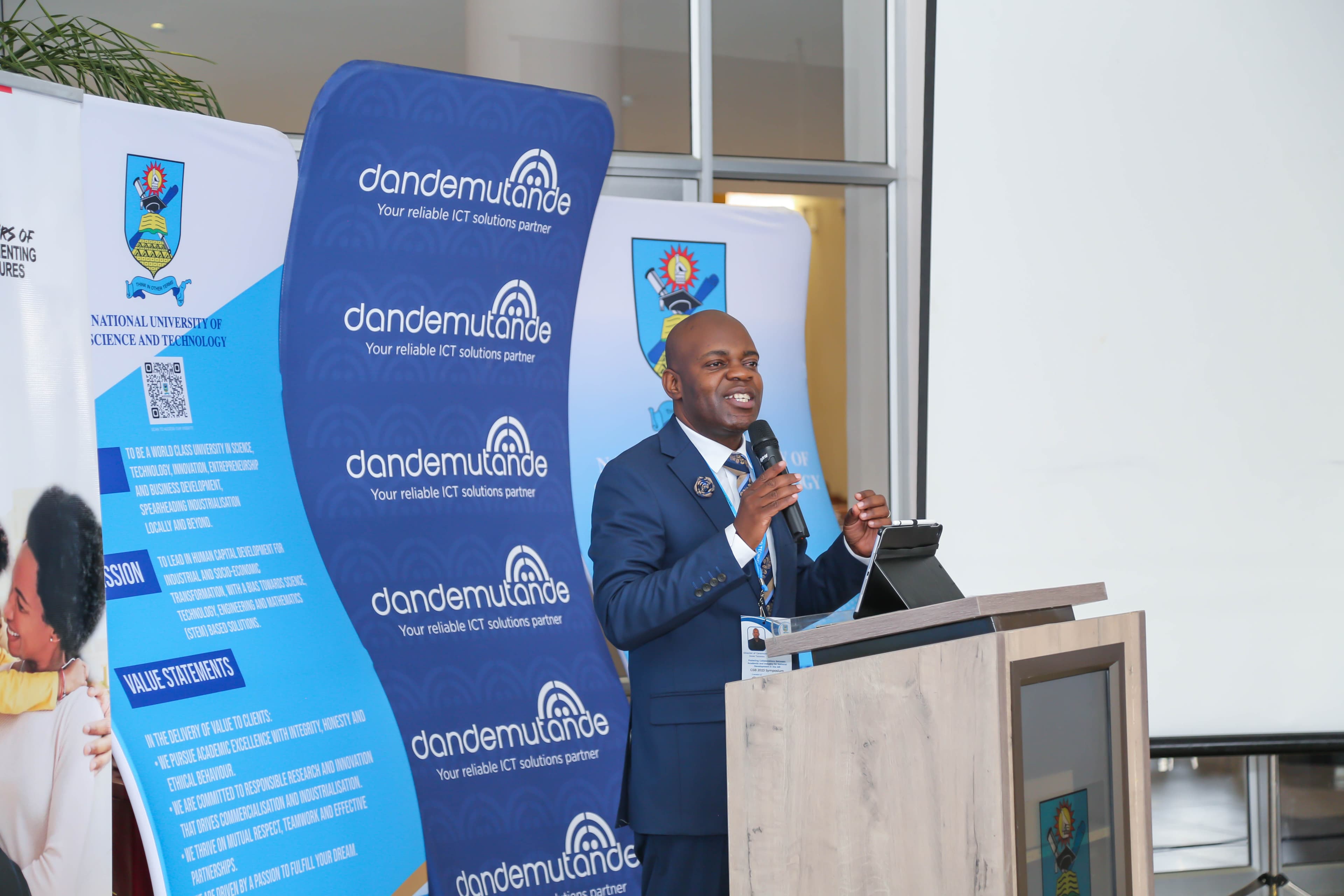 John Tseriwa speaking on stage